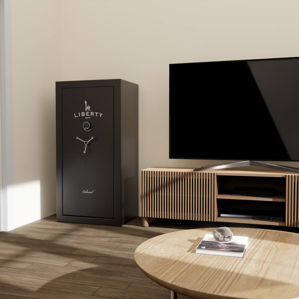 Liberty Colonial 23 CO23 black gun rifle safe in lifestyle setting next to tv entertainment system